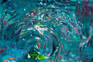 Water waves and colorful splashes top view